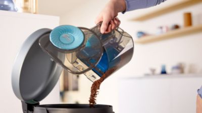 Contenitore della polvere progettato per uno svuotamento igienico con una sola mano