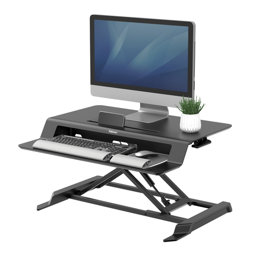 EASILY TRANSITION FROM SITTING TO STANDING WITH GAS SPRING HEIGHT ADJUSTMENT. FL